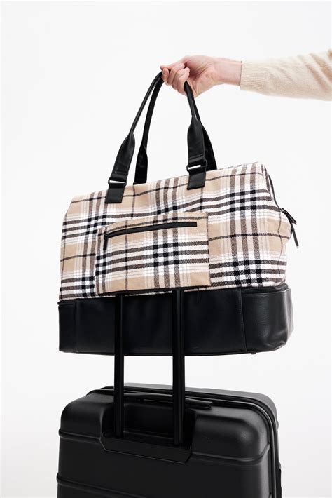 beis plaid weekender bag.